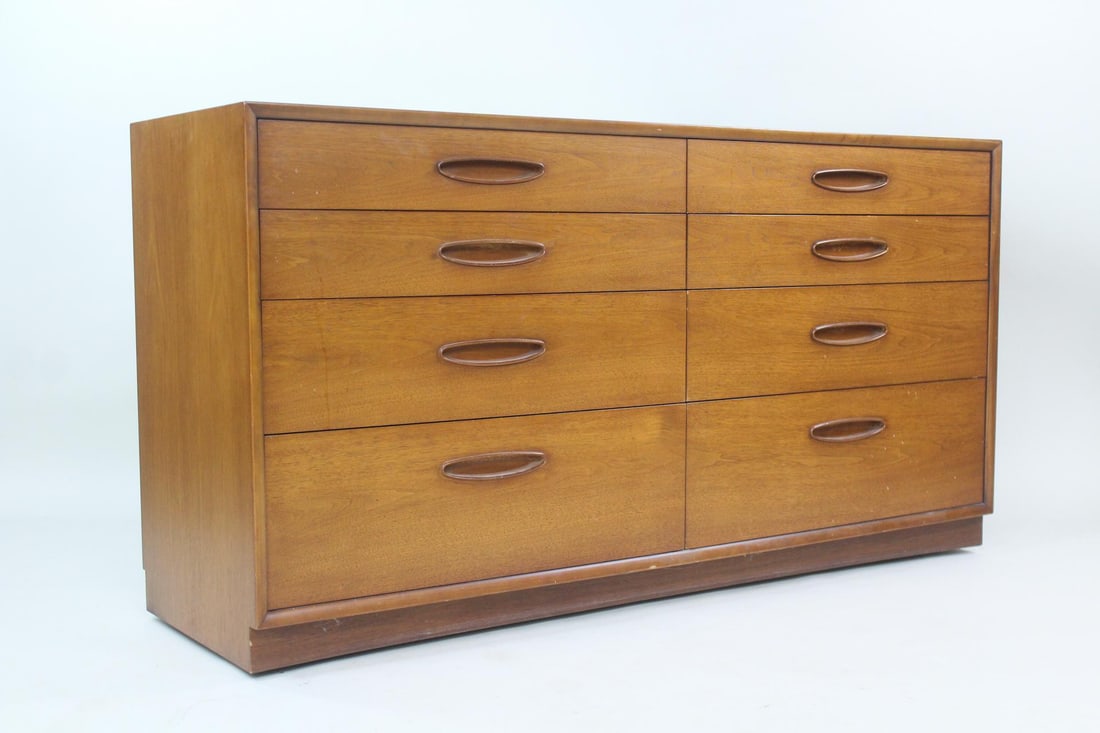 8-Drawer Wooden Dresser, "Circa '60" Collection by Henredon: 8-Drawer Wooden Lowboy Chest of Drawers by Henredon. A lower dresser with eight drawers arranged in two columns with sculptural oval pulls. Made of dark wood, possibly walnut. Marked Circa 60 Henredon
