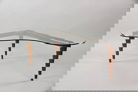 Glass & Wood Biomorphic Coffee Table, Robsjohn-Gibbings: Mid-Century Modern Sculptural Table, Robsjohn-Gibbings. A graceful table with wooden tripod base supporting a kidney-shaped glass tabletop, which appears to float in space. Believed to be T.H. Robsjoh
