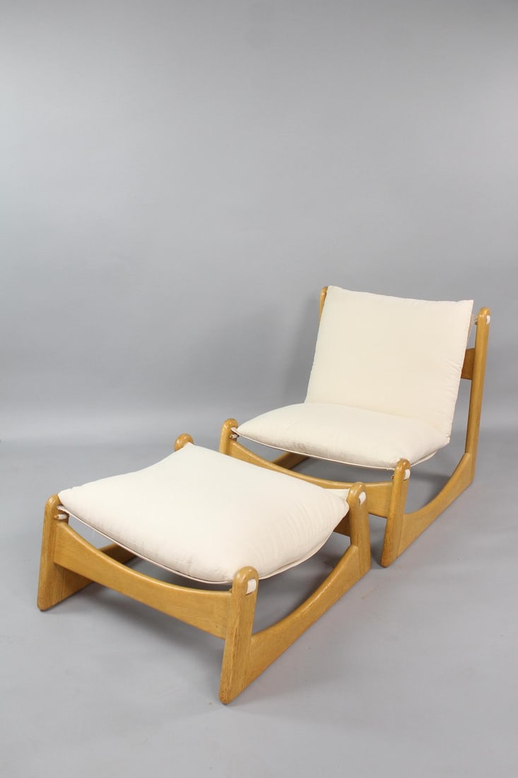 Brutalist Slung Lounge Chair & Ottoman by Carl Staub: Mid-Century Modern Minimalist Wood & Canvas Chair, Ottoman. This lounge chair and matching ottoman have light wood frames, possibly oak or ash, with off-white slung canvas and cushions. Unmarked, we b