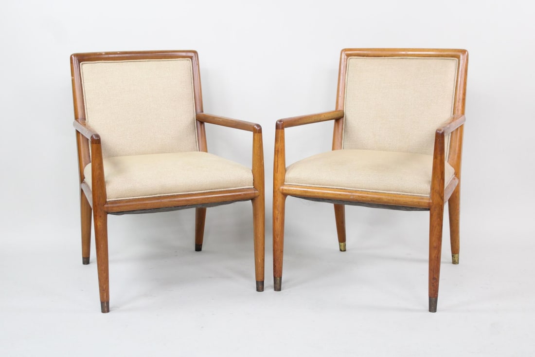 Pair of Arm Chairs, T.H. Robsjohn- Gibbings: Pair of Mid-Century Modern Arm Dining Chairs, Manner of T.H. Robsjohn-Gibbings. Matching pair of chairs with wooden frames and light tan upholstered seats and backs. Unmarked, they are in the manner o