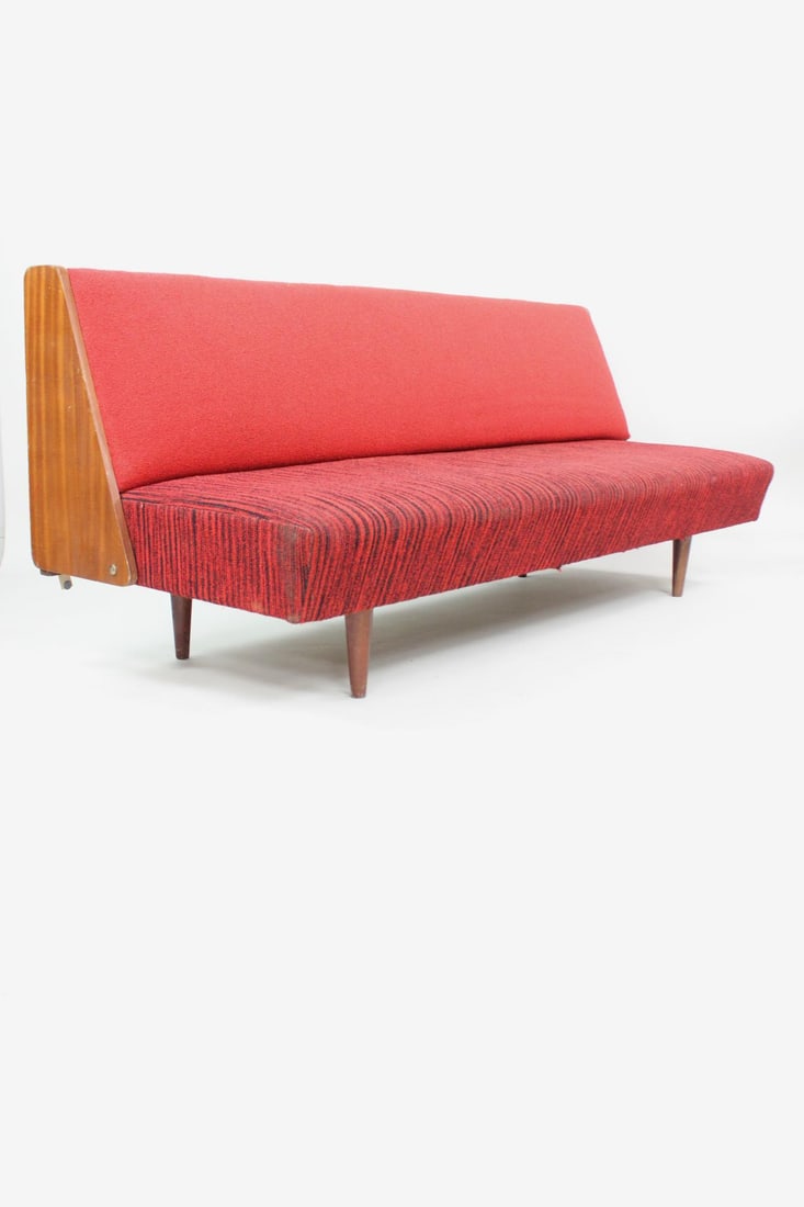 Mid-century Modern Foldable Upholstered Sofa: Mid-century Modern Foldable Upholstered Sofa or Daybed. This clean lined sofa has a solid red upholstered backrest and variegated red & black seat with tapered wooden legs. The wood-sided back drops d