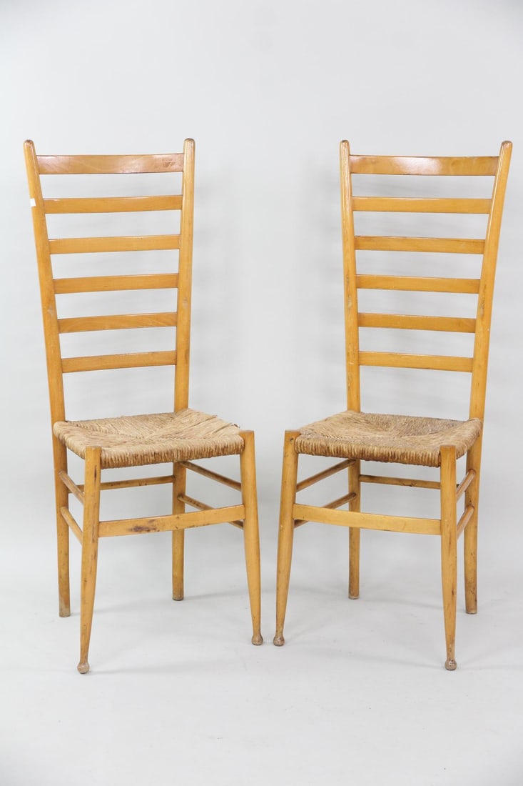 Pair of Italian High Back Chairs after Gio Ponti: Pair of Italian High Back Chairs after Gio Ponti. Matching pair of tall ladder-back chairs in the style of Gio Ponti with woven rush seats and tapered legs. Dimensions are 43 in h x 16 in w x 15 in d.