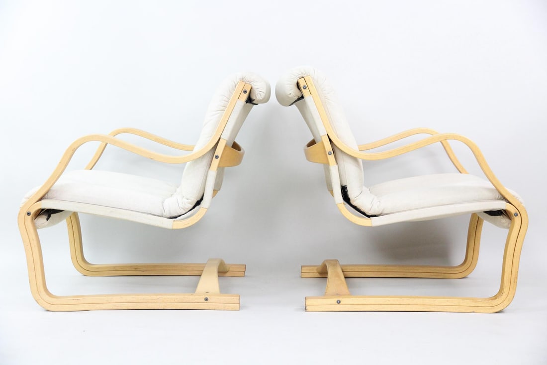 Pair of Bentwood Lounge Chairs, Esko Pajamies for Asko: Pair of Bentwood Lounge Chairs, Esko Pajamies for Asko. They have an Alvar Aalto Style but we believe them to be Esko Pajamies for Asko. Featuring bent plywood frames and tan fabric upholstery. Dimens