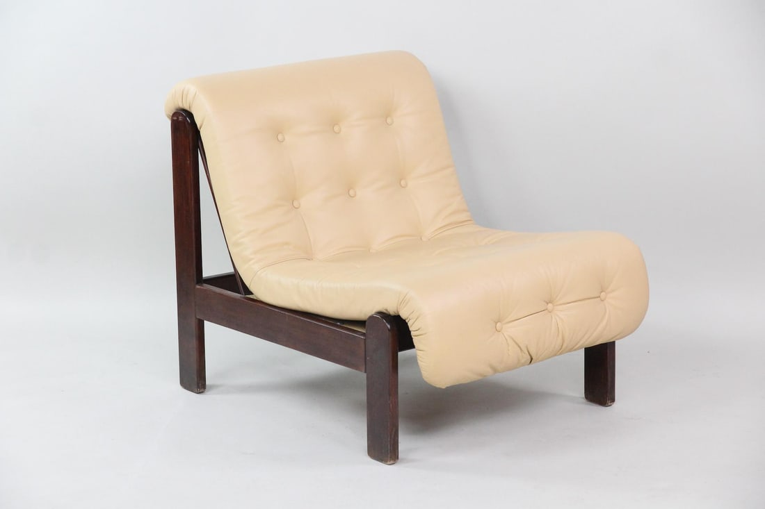 Brazilian Armless Tufted Leather Lounge Chair: Mid-Century Modern Brazilian Armless Tufted Leather Lounge Chair. This chair is in the Manner of Percival Lafer but we believe to be Brazilian design. Plush tan leather chair with dark wood frame. Dim