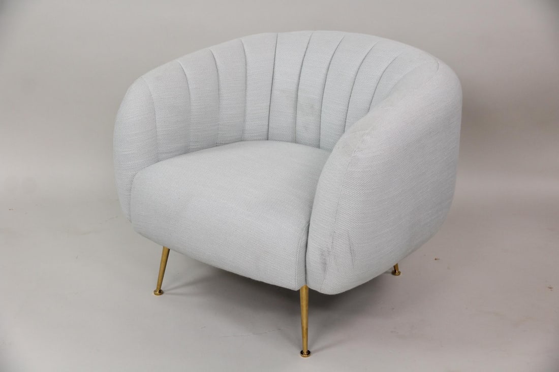 Jonathan Adler "Pompidou" Contemporary Lounge Chair: Jonathan Adler "Pompidou" Club Chair. A stylish barrel-shaped lounge chair, featuring upholstery with vertical channel tufting and sleek brass colored legs. Labeled Jonathan Adler on the underside. Di