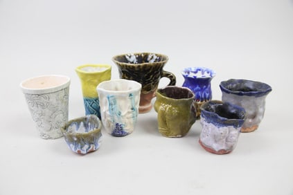 Collection of 9 Hand Built Ceramic Cups by Arnie Zimmerman