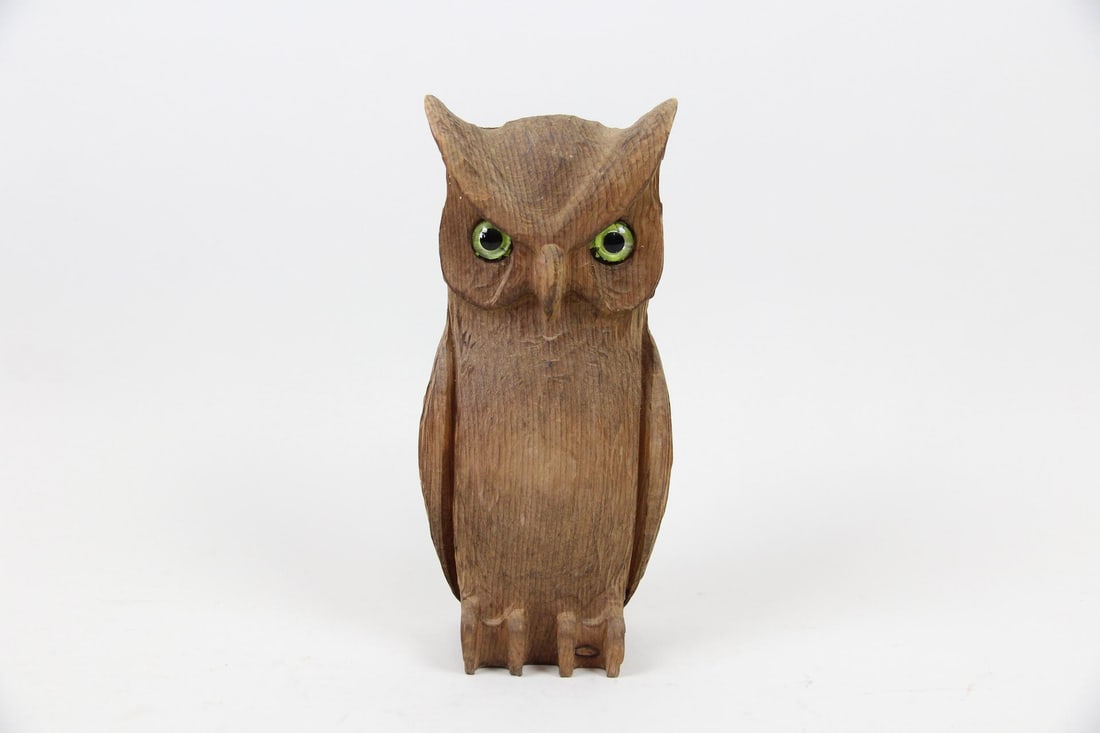 Carved Wood Folk Art Owl Sculpture, Lancaster, PA: Carved Wood Folk Art Owl Sculpture. Perched owl sculpture has glass eyes, and is indistinctly stamped on the underside by the maker, Woodcarvers Lancaster Pennsylvania. Dimensions are 9.75 in h x 4.25
