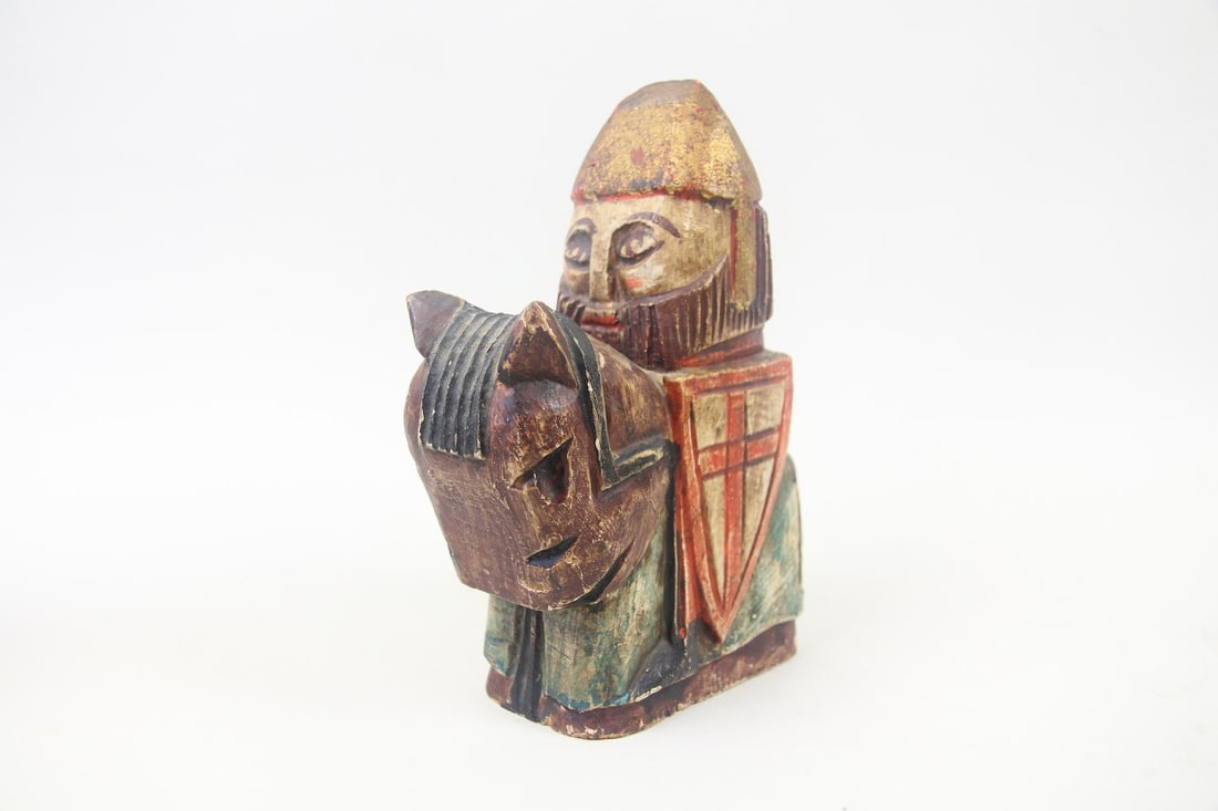 Wooden Spanish Bonachera Andujar Carved Knight: Carved Wooden Statuette of a Crusader Knight. A small stylized statuette of a crusader on horseback with helmet and shield. Patinated surface with red, blue, black, & brown paint. Dimensions are 8 in 
