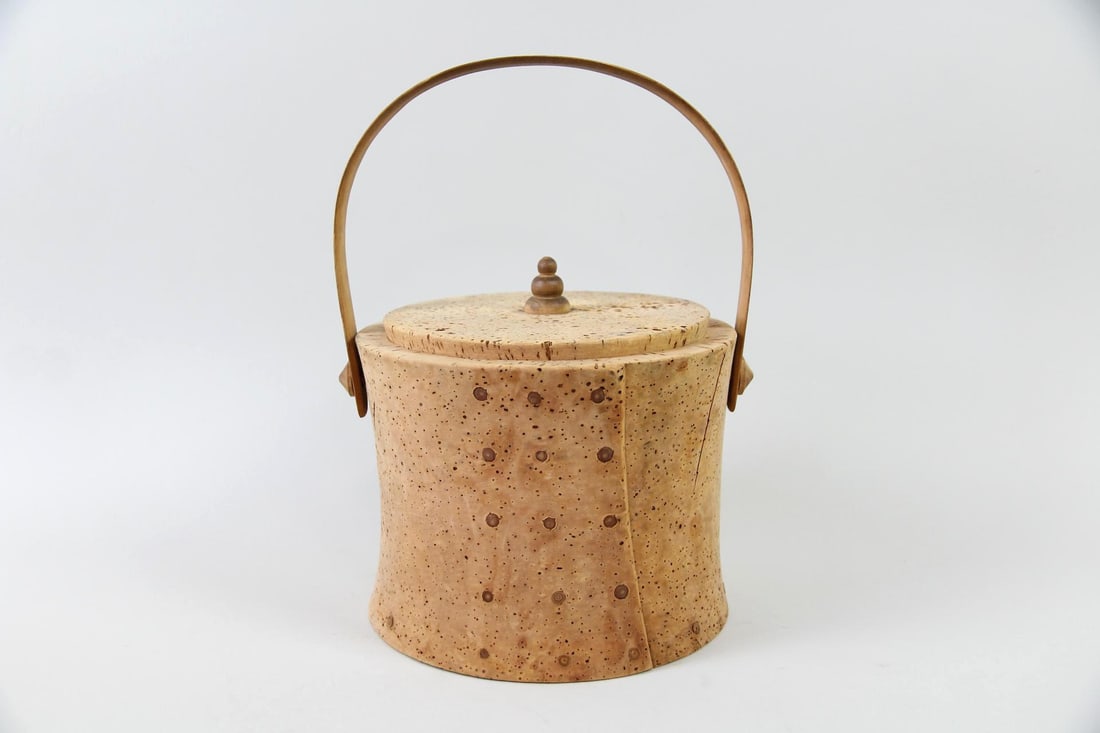 Cork Ice Bucket, Container with Wooden Handle: Mid-Century Modern Cork Ice Bucket with Wooden Handle. A round ice bucket or food storage container made of natural cork with a smooth wooden handle. The interior is lined with metal. Dimensions are 8