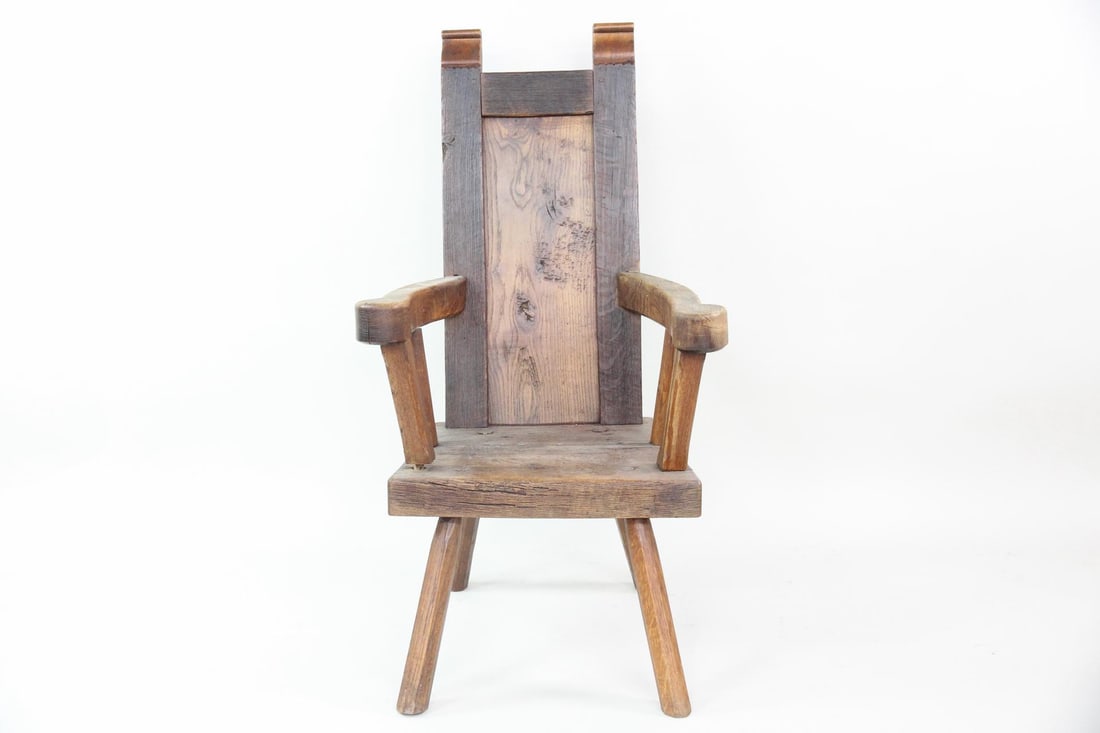 Primitive Scandinavian High Country Carved Oak Tall Chair: Primitive Scandinavian High Country Carved Oak Tall Chair. Chunky "throne" chair with carved arms and legs, thick seat and tall back. Dimensions are 46 in h x 26 in w x 27 in d. Seat height is 16.5 in
