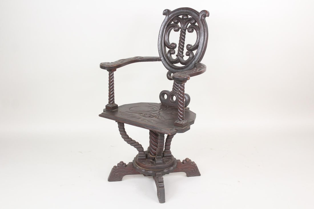 Antique Carved Face Seat Black Forest Style Chair: Antique Carved Face Seat Black Forest Style Chair. This arts and crafts aesthetic armchair has ornately carved rope twist wooden braces and scrolled ornaments, with a seat featuring a bearded face. Di