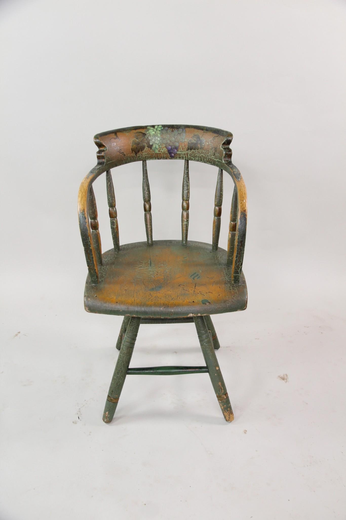 Firehouse Windsor Chair with Painted Grape Motif: Firehouse Windsor Chair with Painted Grape Motif. Firehouse style wooden Windsorarmchair is painted green, with grape clusters and vines hand painted on the back rest. Dimensions are 33 in h x 19 in w
