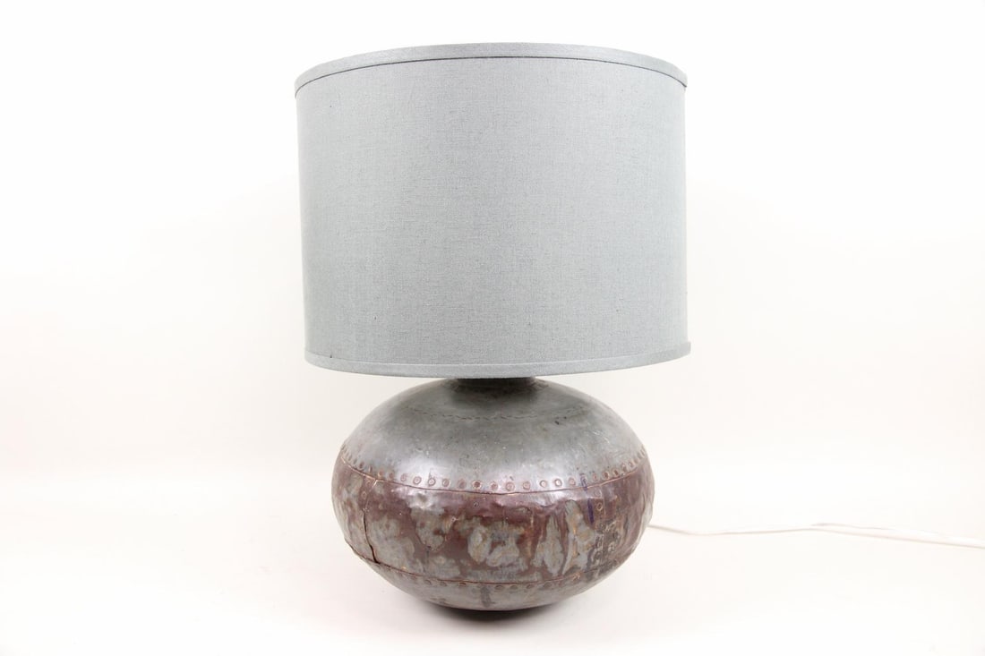 HW Home Caisson Table Lamp, Hammered Metal: HW Home Caisson Table Lamp, Hammered Metal. A table lamp with round textured gunmetal base and blue-gray linen drum shade. Retails new for $865.00. Dimensions of lamp are 24 in h x 13.5 in w x 13.5 in