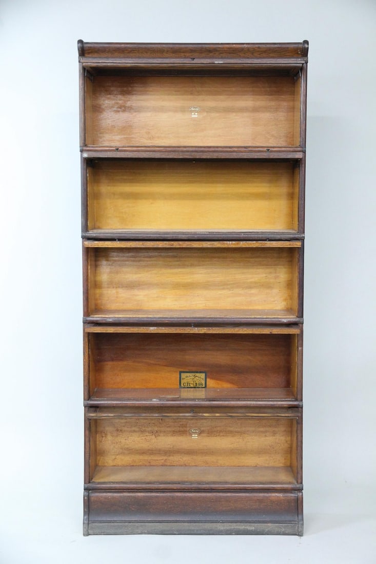 Globe-Wernicke & Macey Japanned Stacking Bookcase: Globe-Wernicke & Macey Japanned Sectional Stacking Oak Barrister Bookcase. Modular oak & glass bookshelfis made up of 7sections: a base, five middle compartments, and a top piece.The glass doors slide