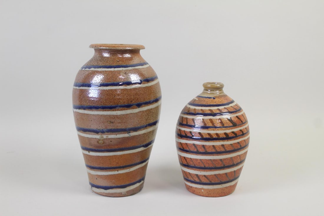 Pair of Spiral Striped Decorated Stoneware Vases, Cornwall Bridge Pottery: Pair of Studio Pottery Striped Stoneware Vases. Pair of hand thrownpottery vases, with brown glaze and decorated with a spiral of white and cobalt blue. Both stamped CBP, likely Cornwall Bridge Potter
