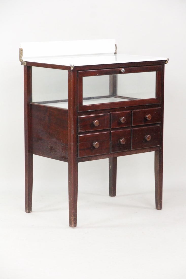 W.D. Allison Co. Milk Glass Apothecary Display Cabinet: W.D. Allison Co. Milk Glass & Wood Apothecary Store Display Cabinet. This cabinet has a milk glass top with splash board, hinged windowed compartment with milk glass base, and six drawers. Metal detai