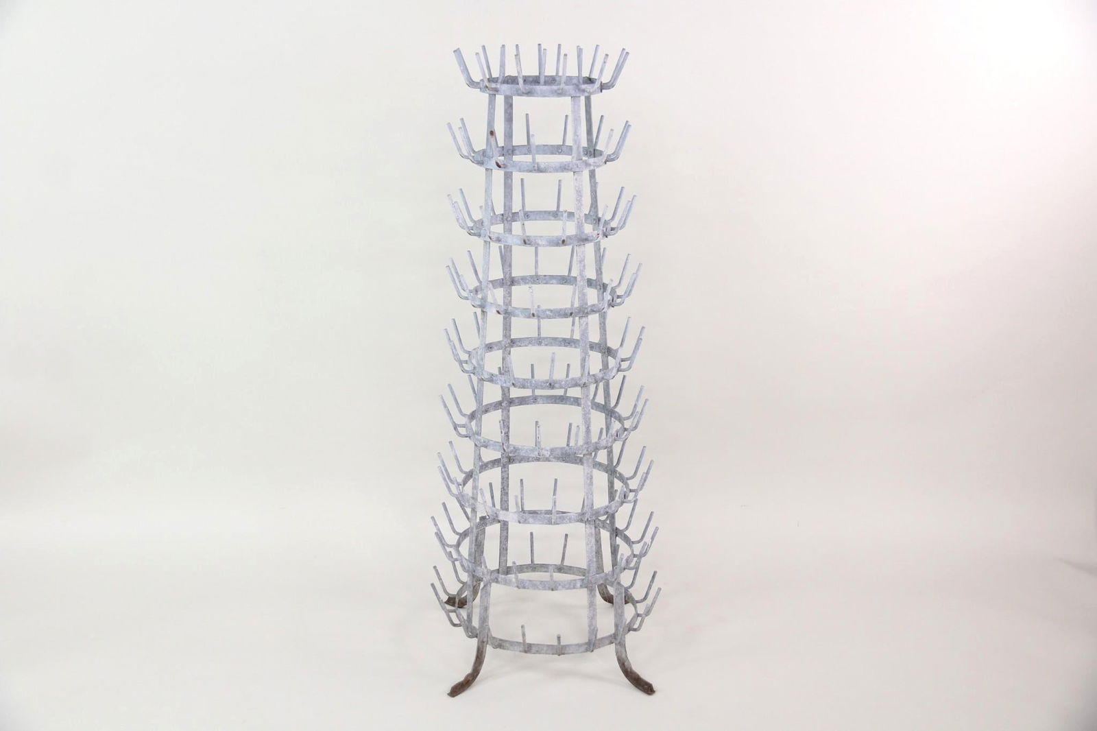 Galvanized Zinc 9 Tier French Bottle Drying Rack: Industrial Galvanized French Wine Bottle Drying Rack. A sturdy rack with 9 multipronged tiers. Originally made to dry wine or champagne bottles. Dimensions are 49 in h x 13 in w x 23 in d. Condition i