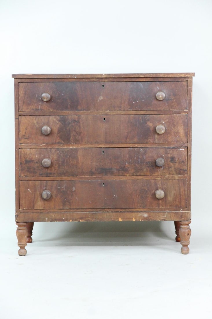 Victorian Mahogany 4 Drawer Dresser: Victorian Mahogany 4 Drawer Dresser, Chest of Drawers. Four drawer dresser featuring turned feet and turned wood pulls. Dimensions are 40.5 in h x 40 in w x 17 in d. Condition is fair with heavy venee