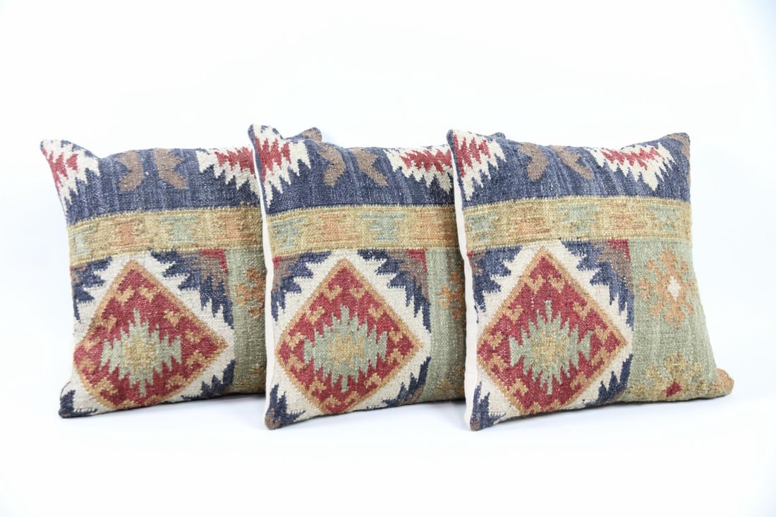 Set of 3 Turkish Kilim Throw Pillows: Set of 3 Turkish Kilim Throw Pillows. Matching woven wool pillows with tribal patterns in tan, rose, blue, and green. With zipper closure and inserts. Dimensions are 16 in h x 18 in w x 5 in d. Condit