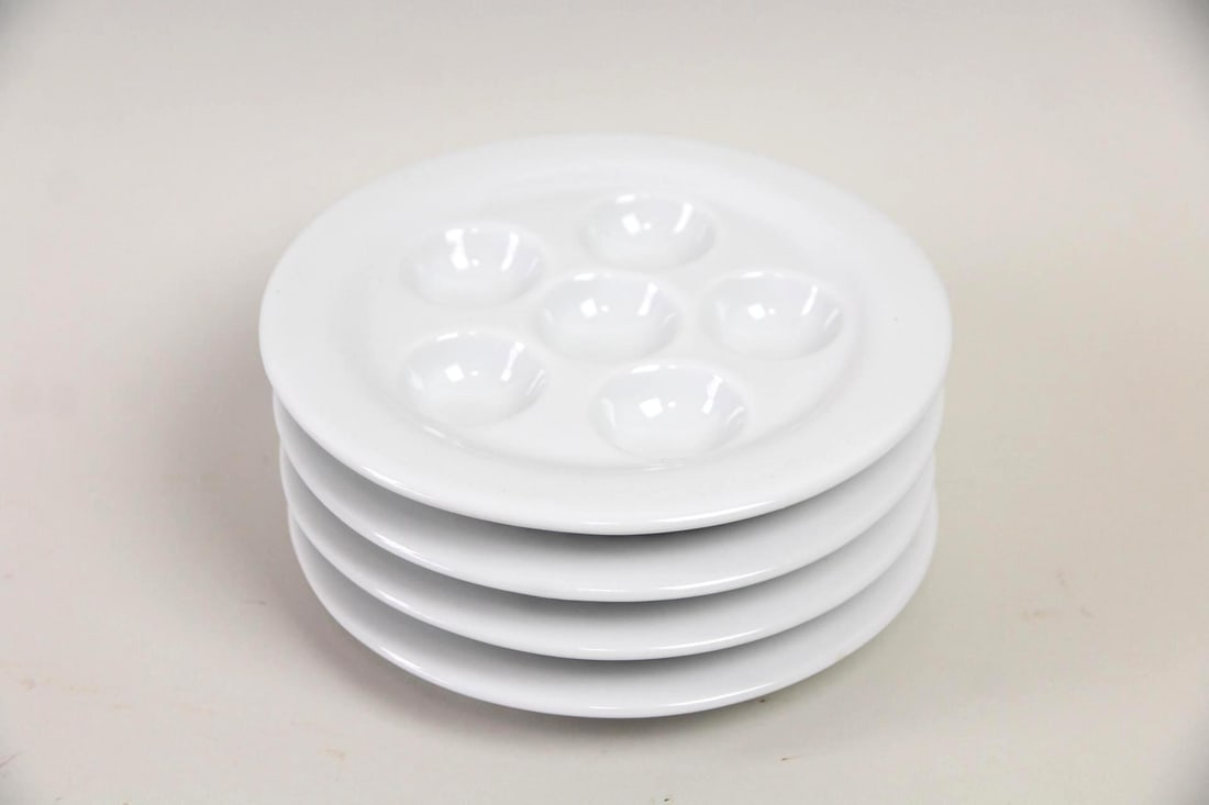 Set of 4 Porcelain Escargot Dishes, Trudeau: Set of 4 Porcelain Escargot Dishes, Trudeau. This is a set of porcelain dishes, with each dish having six wells for serving escargot. Marked Trudeau to bottom.Dimensions are .75 in h x 6.75 in w x 6.7
