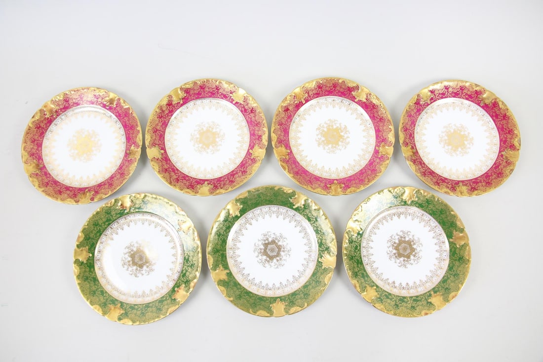 Set of 7 GDA Limoges Porcelain Salad Plates in Raspberry & Green: Set of & GDA Limoges Porcelain Plates in Raspberry & Green. Seven matching salad or dessert plates ornately decorated in gilt floral patterns with 4 in raspberry pink background, and 3 with green. By