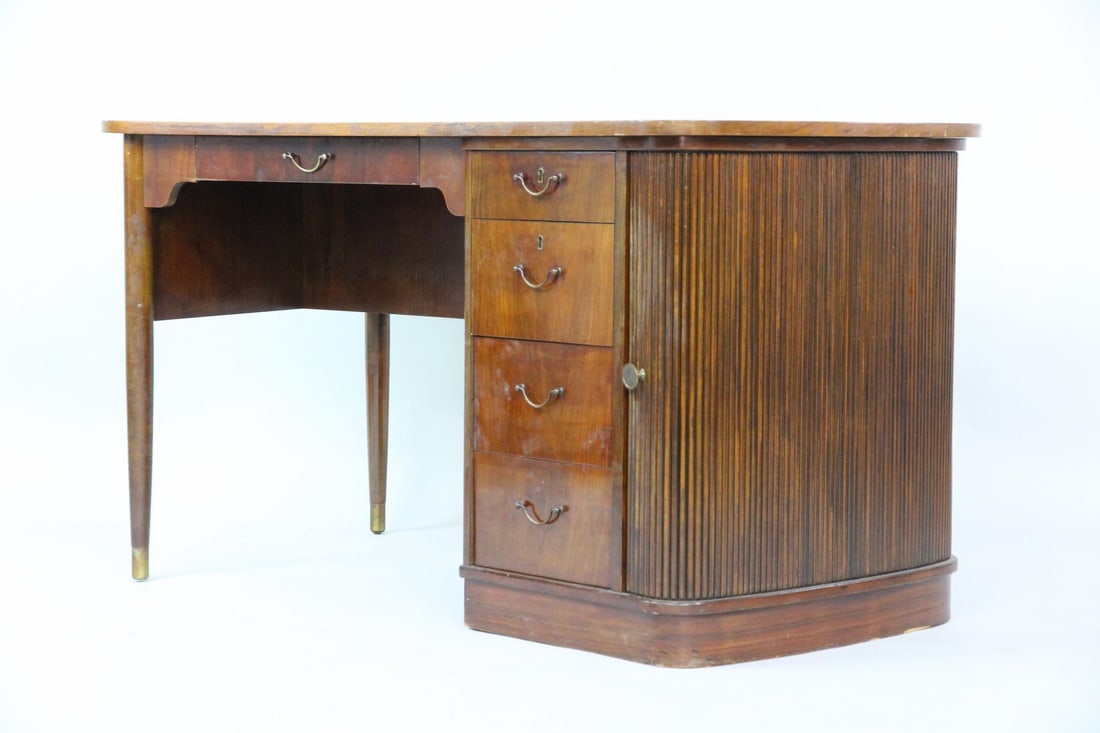 Danish Modern Executive Desk, Wood & Brass with Tambour: Danish Mid-century Modern Wood & Brass Desk with Tambour. A handsome desk with a subtle kidney shape. It has a single central drawer and filing drawers to the right. It has tapered legs, brass hardwar