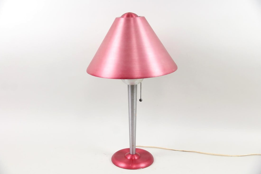 Soundrite Machine Age Table Lamp, Brushed Aluminum, Pink: Soundrite Art Deco Machine Age Table Lamp, Brushed Aluminum, Pink. A Soundrite table lamp with a pink brushed aluminum base and sleek conical shade. Includes a pull chain switch. Labeled on the