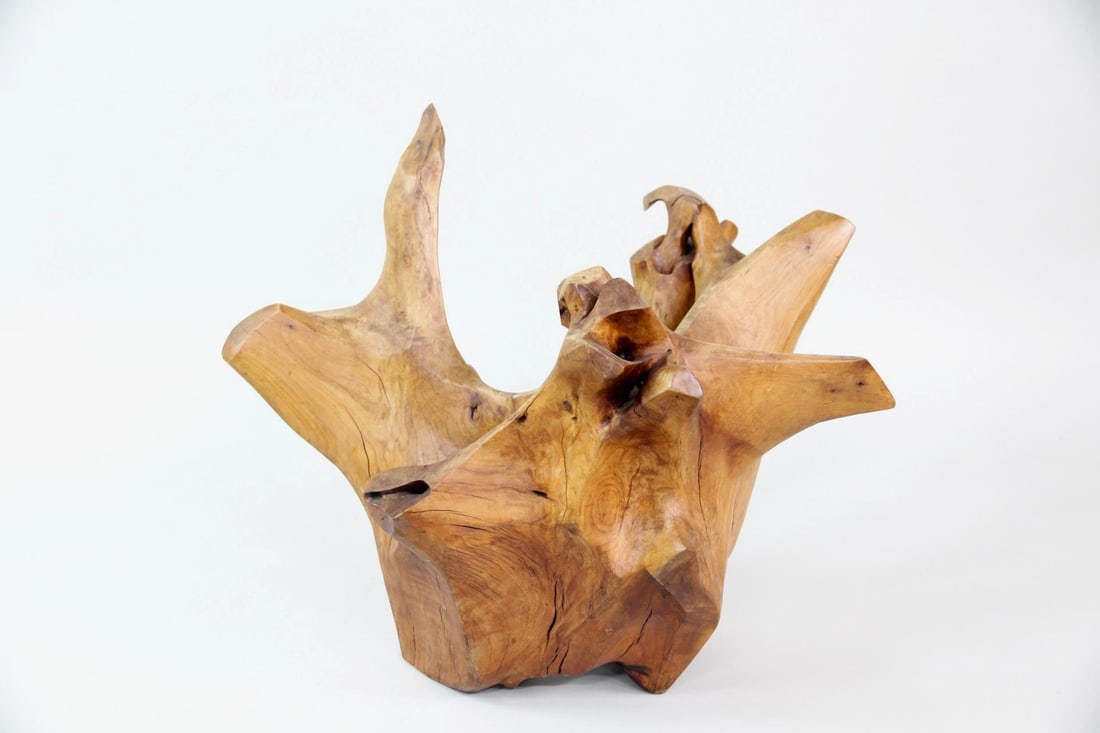 Mid Century Modern Carved Wooden Live Edge Sculpture: Modern Carved Wood Organic Live Edge Sculpture. An abstracted, organic form with soft facets and hook-like shapes, carved from a single piece of warm toned wood. Dimensions are 21.5 in h x 26 in w