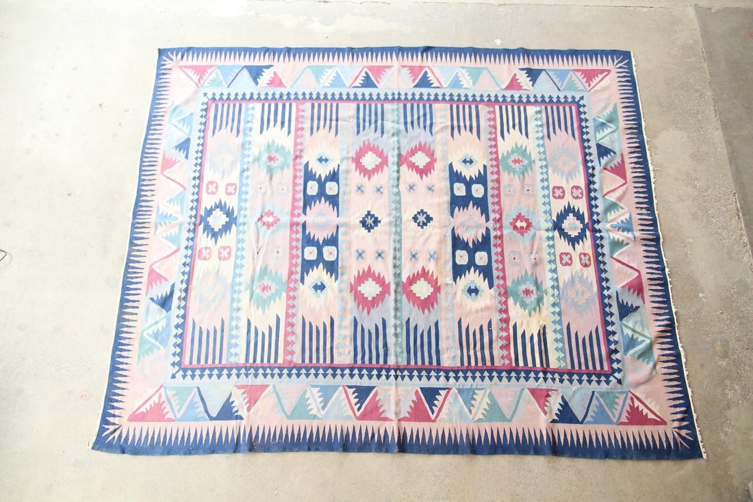 Geometric Turkish Kilim Wool Rug, Teal & Pink, 8 x 10 Ft: Geometric Turkish Kilim Wool Rug, Teal & Pink, 8 x 10 Ft. A handwoven wool rug with a serrated border and bold geometric motifs in blue, teal, and pink. Soft and flexible. Dimensions are 119 in l x 98