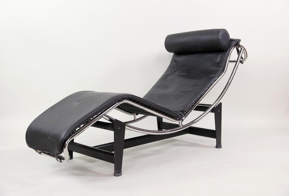 Le Corbusier LC4 Leather Lounge Chair: Mid-Century Modern Le Corbusier LC4 Leather Lounge Chair. A sleek, adjustable black leather & chrome chaise lounge with buckled headrest, in the style of Le Corbusier's iconic LC4. This chair has no m