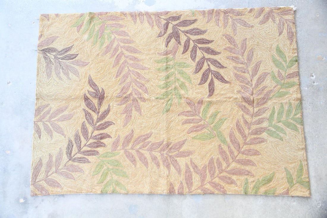 Hooked Wool Rug, Brown & Green Leaves: Botanical Hooked Wool Rug, Brown & Green Leaves. A hooked rug with a fluid pattern of brown & green vined leaves, made of wool on a linen ground. Dimensions are 86 in h x 61 in w x .26 in d. Condition