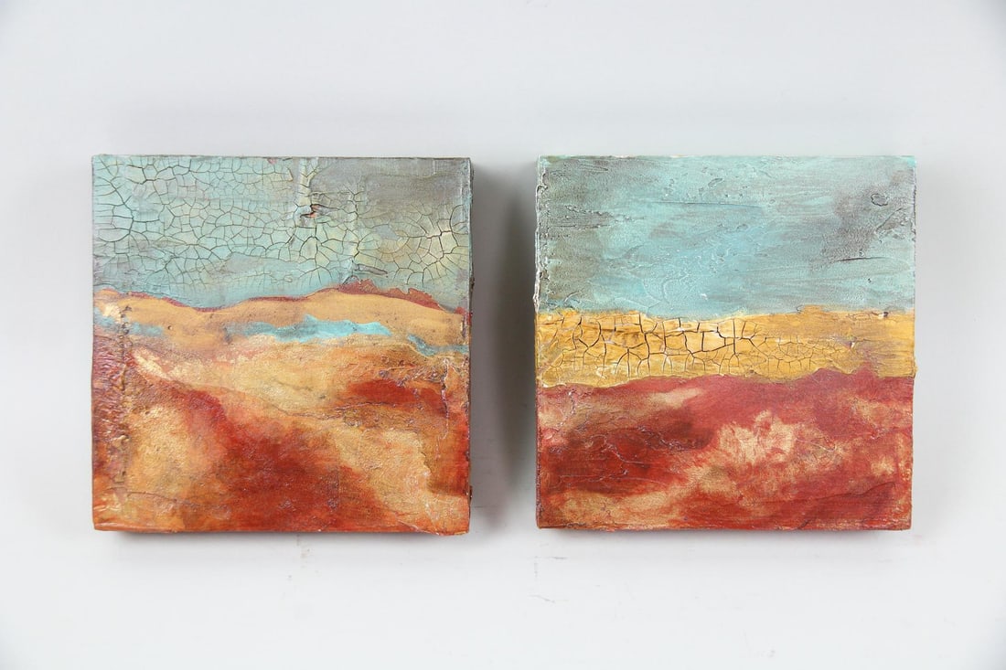 Pair of Abstract Mixed Media Paintings by Merry Calderoni: Pair of Abstract Mixed Media Paintings by Merry Calderoni. Two square textural paintings on open cradled panel in a primary color palette of sky blue, ochre, and red. Artist's information included on 