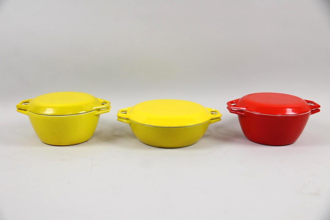 Group of 3 Copco Denmark Enamelware Dutch Ovens: Group of 3 Mid-Century Modern Copco Denmark Michael Lax Pots, Dutch Ovens. 3 heavy, enameled cast iron pots, two in primary yellow & one in red. They have tight fitting lids with integrated handles.