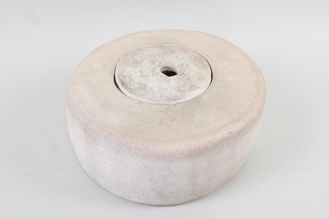 Lidded Pottery Vessel with Coiled Interior: Modernist Lidded Pottery Vessel with Coiled Interior. Off-white round pottery container, with a coiled pottery interior and a lid. Dimensions are 5.5 in h x 12.5 in w x 12..5 in d. Condition is