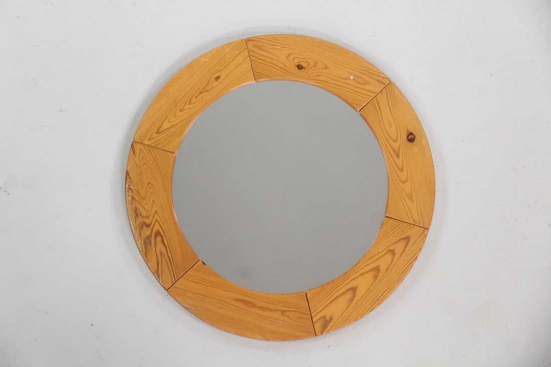 Danish Modern Round Pine Mirror: Danish Mid-Century Modern Round Pine Mirror. Minimalist round wall mirror in a segmented natural pine frame.Dimensions are 23.5 in h x 23.5 in w x 1 in d. Condition is good with some scuffs to the fra