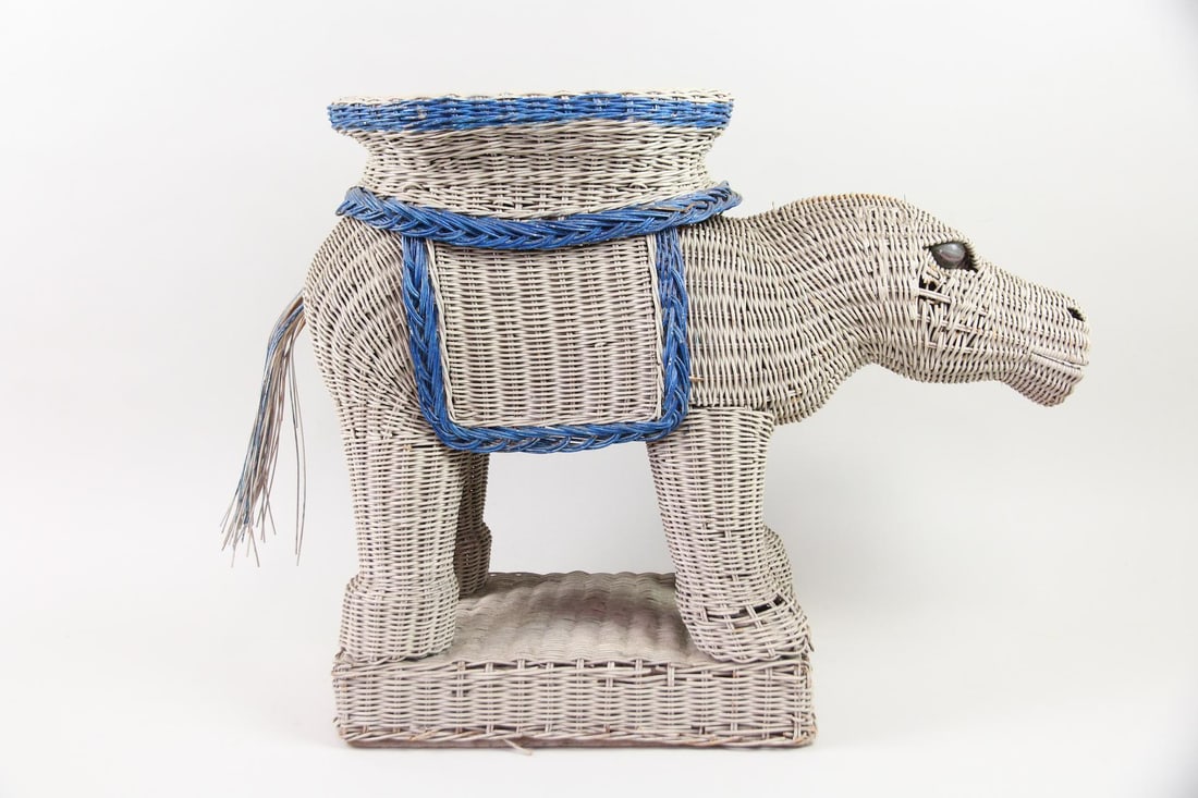 Wicker Hippo Plant Stand or Side Table, Boho: Wicker Hippo Plant Stand or Side Table, Boho. Blue and white painted wicker stand in the form of a hippopotamus, complete with tail and glass marble eyes. Dimensions are 20.25 in h x 26 in w x 9.5