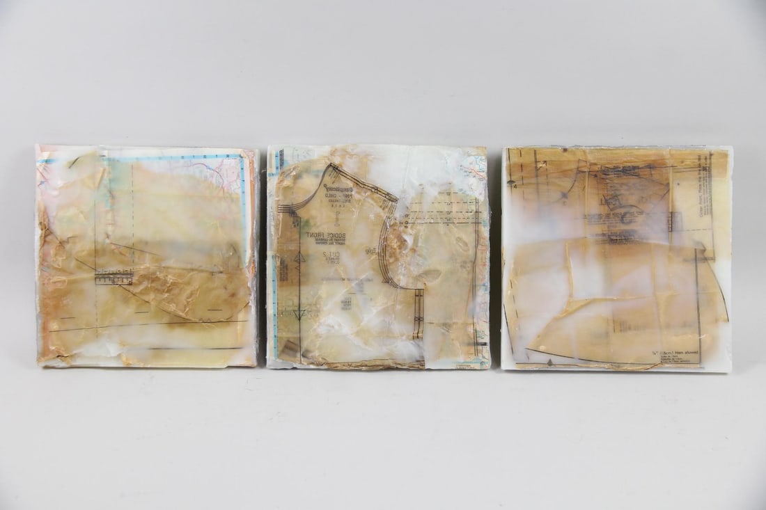 Group of 3 Abstract Encaustic Assemblages by Martha Saunders: Group of 3 Encaustic Collage Paintings by Martha Saunders. Three square encaustic works on panel in neutral tones, with maps and pattern making paper collage elements. Unsigned, these are by American