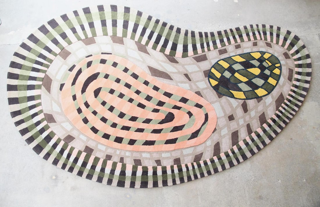 Abstract Biomorphic Wool Rug, Checkered Grids, 13 x 8 Ft: Abstract Biomorphic Wool Rug, Checkered Grids, 13 x 8 Ft. A custom-made kidney-shaped wool rug with complex gridded patterns in coral, sage green, taupe, and umber. Dense, soft pile.Dimensions are 162