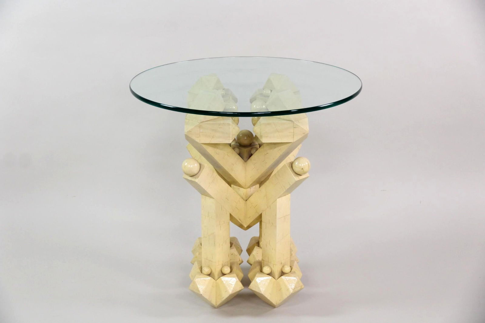 Postmodern Sculptural Faux Birch and Glass Side Table: Postmodern Sculptural Faux Birch and Glass Side Table. A side table with strong architectural geometry, made of faux birch wood with a glass top. An intriguing form from all angles. Dimensions are 26