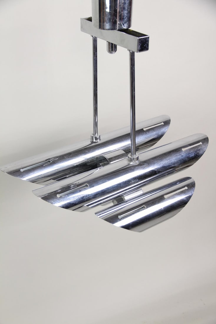 Space Age Chrome Tube Hanging Light Fixture: Space Age Chrome Tube Hanging Light Fixture. Unusual hanging light with graduated chrome plated tubes.Dimensions are 26 in h x 16 in w x 23 in d. Condition is good with some minor pitting. Solid and s