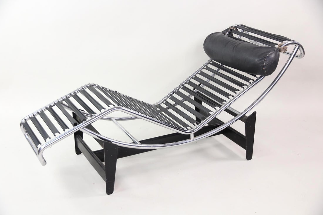 Mid-Century Modern Le Corbusier LC4 Lounge Chair: Mid-Century Modern Le Corbusier LC4 Leather Chair. A sleek, adjustable black leather & chrome chaise lounge with rubber coated coil supports and buckled headrest. This chair has no maker's marks and i