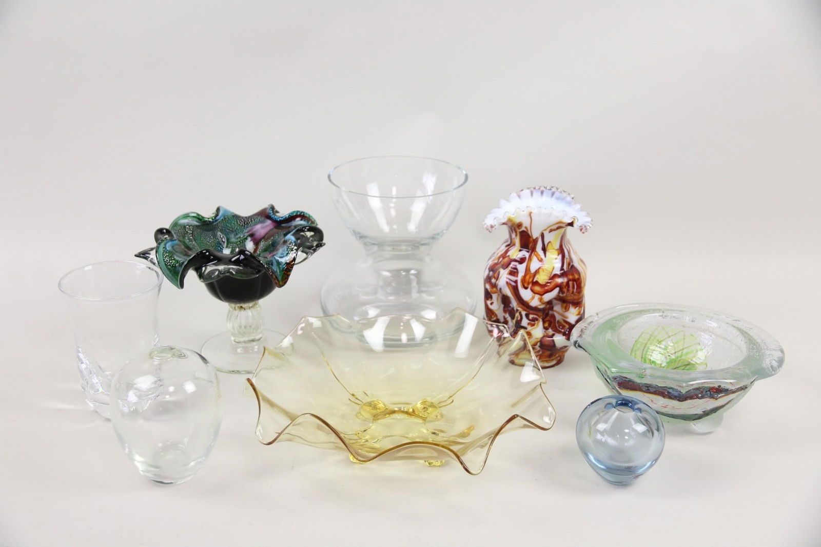 Lot of 7 Mid-Century Modern Glass Vessels, Murano: Lot of 7 Mid-Century Modern Glass Vessels, Murano. Includes a Murano pedestal bowl in Tutti Frutti, a topaz footed dish with ruffled edge, a red, white and yellow vase with ruffled rim (possibly