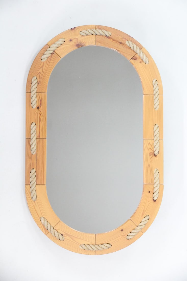 Danish Pine & Rope Nautical Oval Mirror: Danish Mid-Century Modern Pine & Rope Nautical Oval Mirror. Oval wall mirror with a natural pine frame, embellished with rope. Dimensions are 45.25 in h x 27.5 in w x 1.75 in d. Condition is good