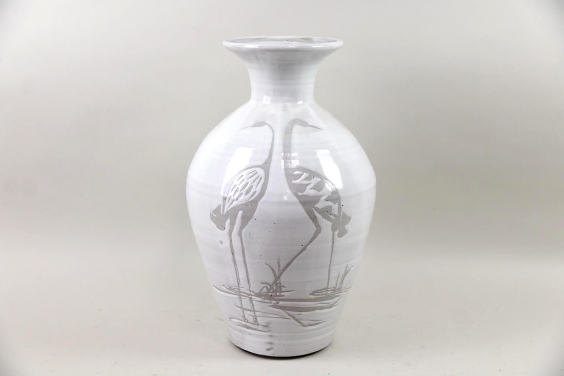 Standing Ceramic Floor Vase, White with Cranes: Standing Ceramic Floor Vase, White with Cranes. This is a hand-thrown ceramic floor vase with a rounded body and flared rim. It is glazed in glossy white with a resist-drawn image of two water birds.