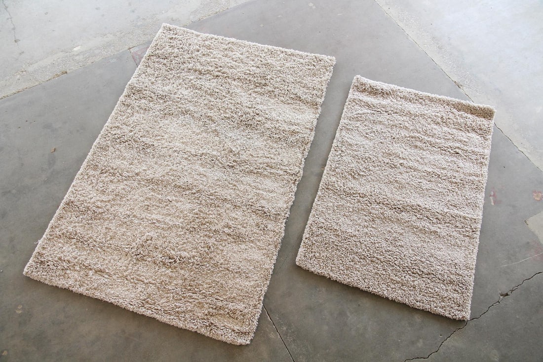 Lot of 2 Minimalist Taupe Shag Rugs, Unique Loom: Lot of 2 Contemporary Minimalist Taupe Shag Rugs, Unique Loom. Two rectangular shag rugs in solid taupe color with cotton backing and poly fiber. Labeled to corner, Unique Loom. Dimensions are 144