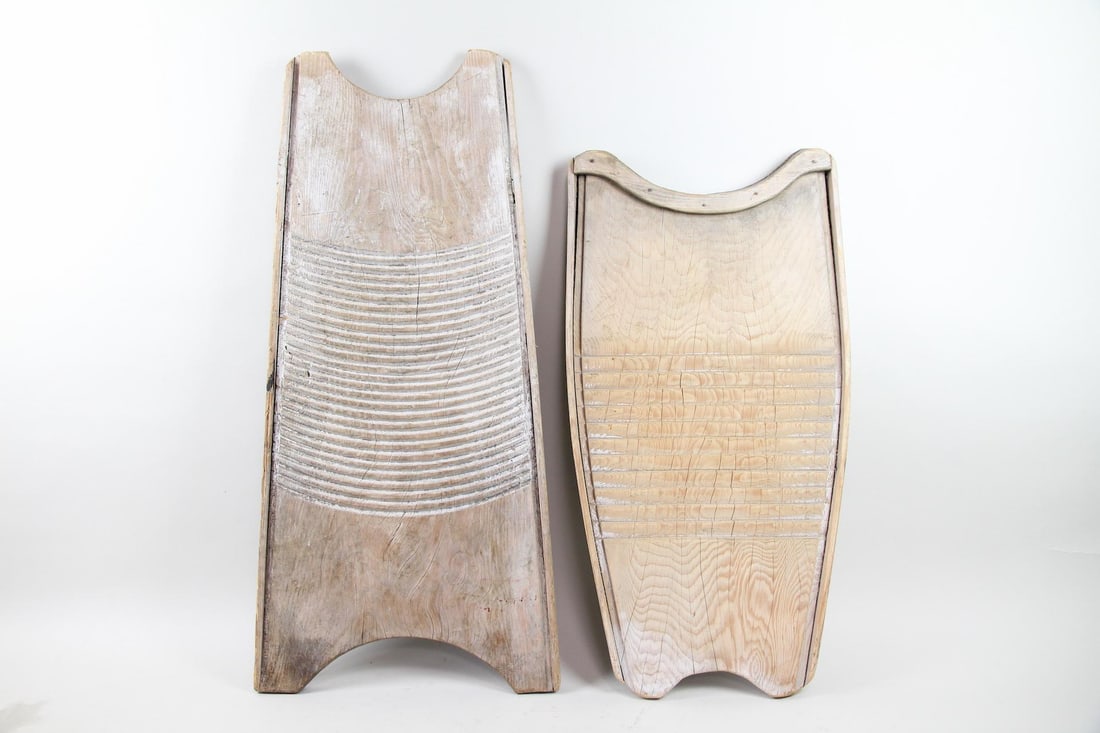 Lot of 2 Primitive Carved Wooden Washboards: Lot of 2 Primitive French Wooden Washboards. Two washboards, carved from wood, with sculptural shapes and nice patina. Dimensions are 33.5 in h x 17 in w x 1.75 in d and 40 in h x 14.5 in w x 1 in d.