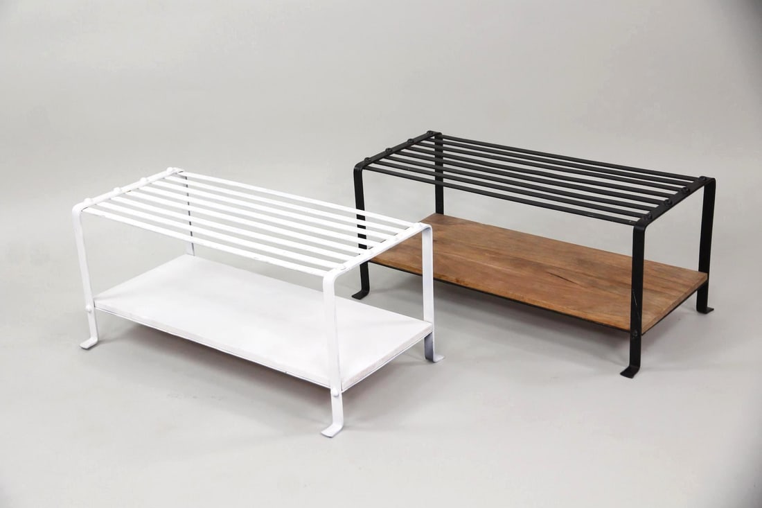 Pair of Contemporary Industrial Shoe Racks, Wood & Metal: Pair of Contemporary Industrial Shoe Racks, Wood & Metal. A pair of two-tiered shoe racks, one in white and one in black, with slatted metal frames and lower wooden shelf. Dimensions are 13.5 in