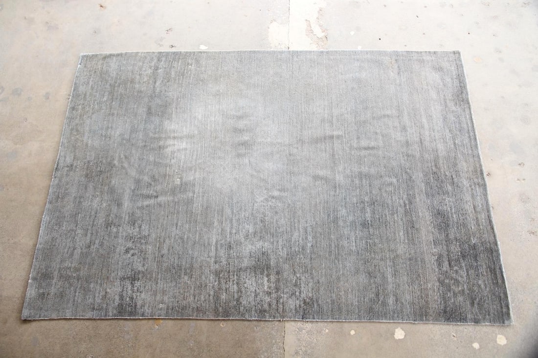 Minimalist Wool Rug, Muted Teal: Minimalist Wool Rug, Muted Teal. A simple, minimalist rug made of knotted wool in a soft teal tone. Dimensions are 111 in l x 75 in w. Condition is good with wear to center. Please call or email for a