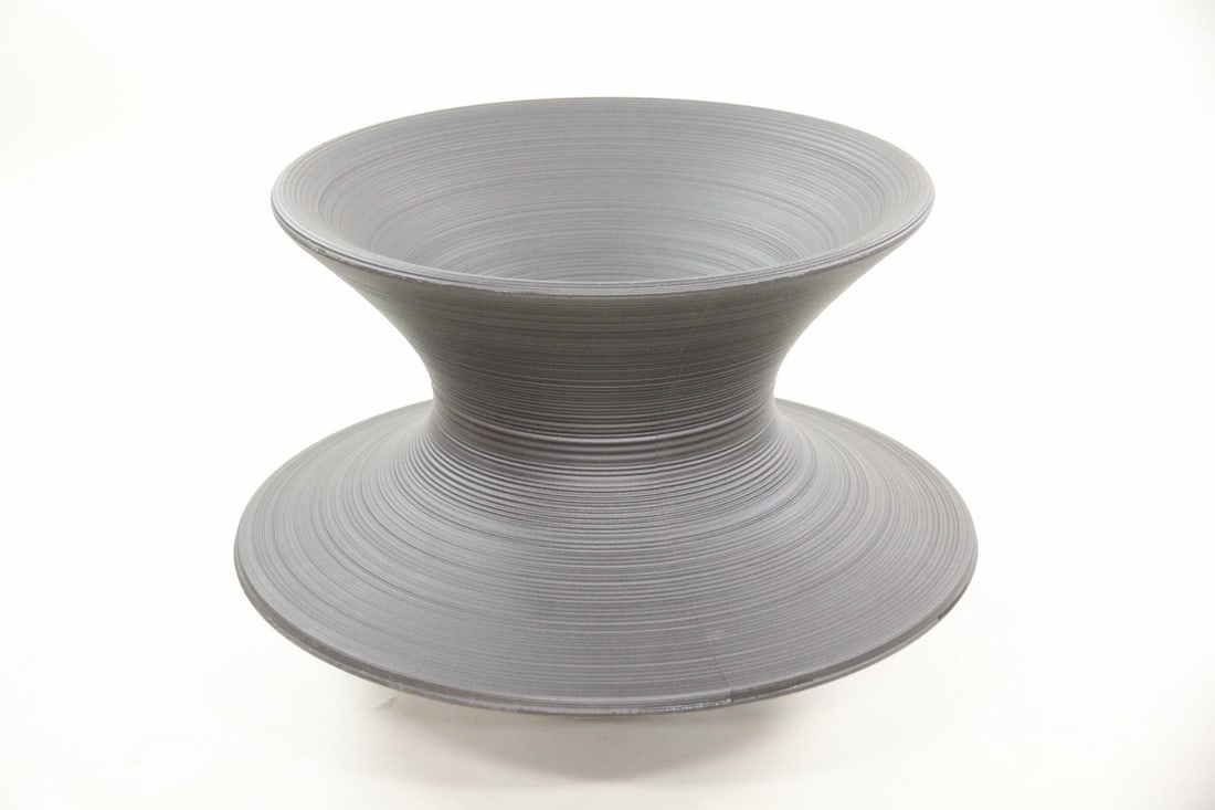 Thomas Heatherwick Magis Spun Chair, Black: Thomas Heatherwick Magis Spun Chair, Black Polypropylene. Fantastic spun chair spina around in a full 360 degree circle; it can also rest on an edge. Embossed marks to the bottom, Magis, Italy,