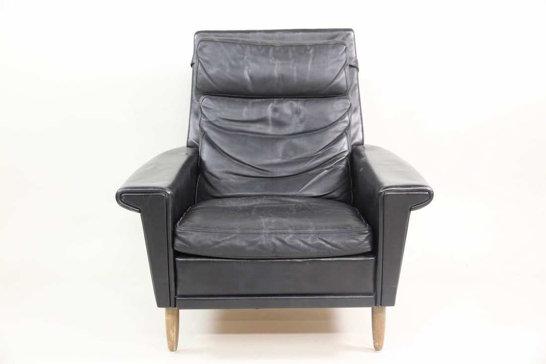 Black Leather Lounge Chair with Sculpted Arms, Georg Thams: Danish Mid-century Modern Black Leather Lounge Chair with Sculpted Arms. Black leather chair with padded headrest and sculptural arms, with similarities in design to Georg Thams. Dimensions are 37 in 